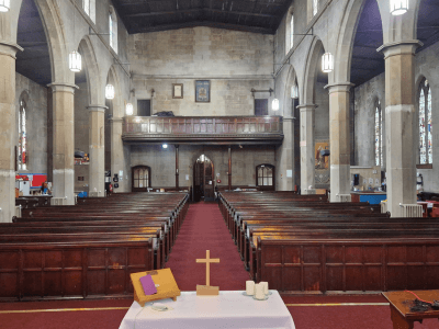 inside St.Georges Church in Tyldesley showing the pews on either side of the aisle