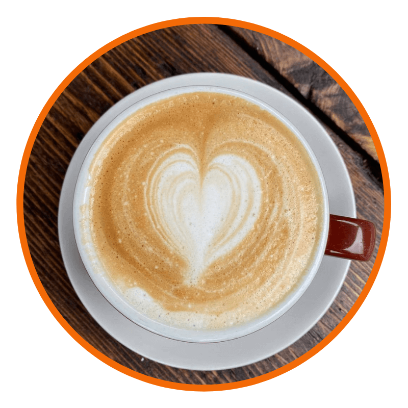 image shows a latte with heart shaped latte art