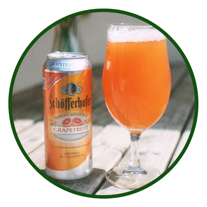 Image show a drinks can with a glass to the side filled with Schöfferhofer Hefeweizen grapefruit beer